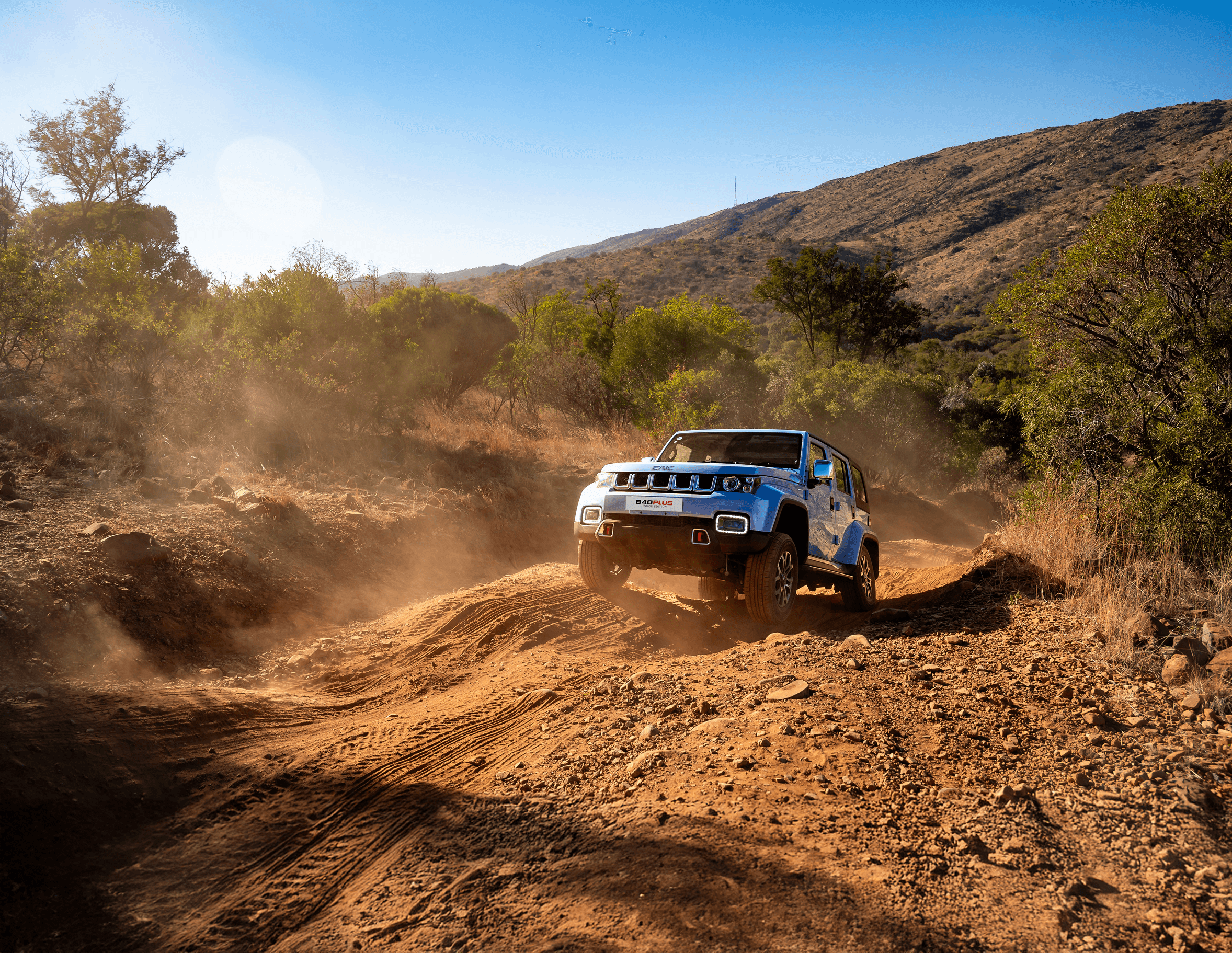 BAIC B40 conquering rugged off-road terrain with dust clouds